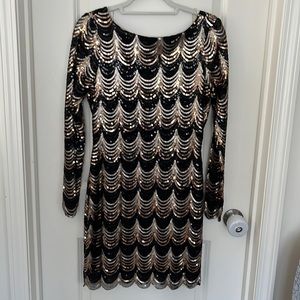 Beautiful black and gold sequience fitted dress